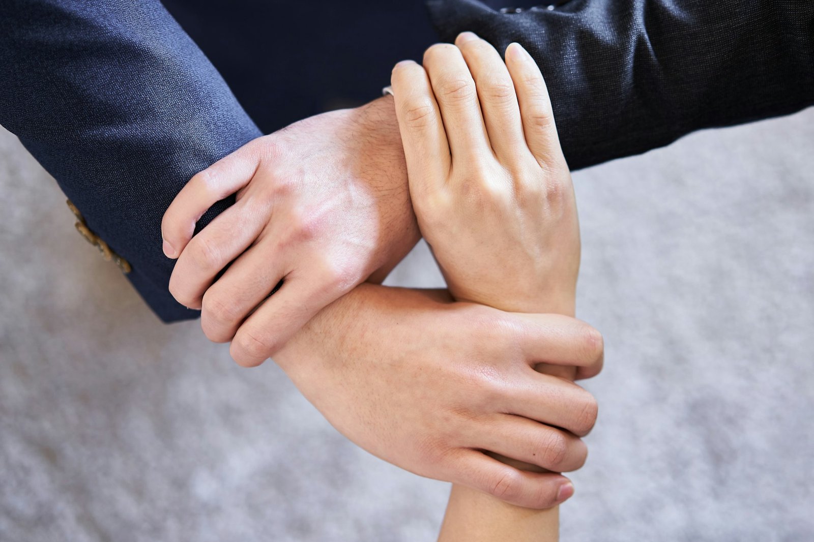 At hand of a united Asian business person